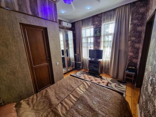 Hostel Sadu Kutaisi tesisinde bir odada yatak veya yataklar