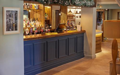 a blue bar with a laptop on top of it at Castle Hotel by Chef & Brewer Collection in Leicester