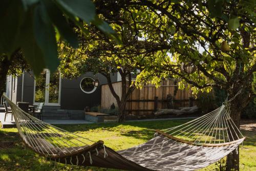 a hammock hanging from a tree in a yard at Villa federleicht in Medebach