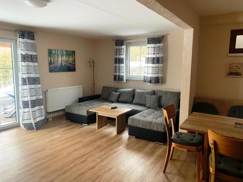 a living room with a couch and a table at Kollerhof in Neunburg vorm Wald