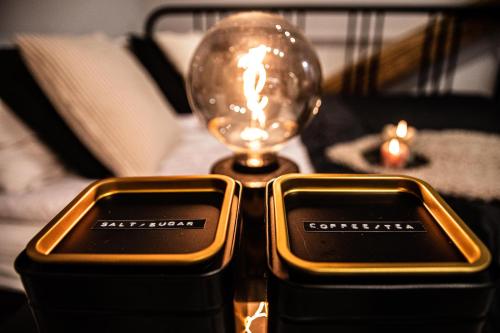 a pair of cris detectors on a table with a light bulb at Wine Apartments in Kraków