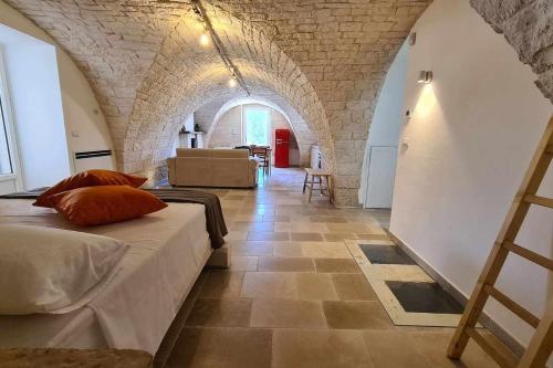 A bed or beds in a room at Dimora Maria Charming Home