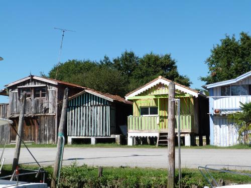 a row of corrugated iron houses in a street at Etche Ona in Pyla-sur-Mer