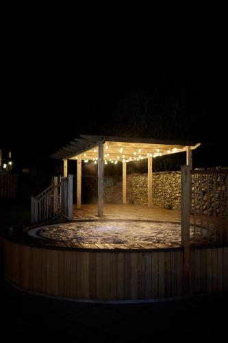 a pavilion lit up at night with lights at The Swan Hotel and Spa in Newby Bridge