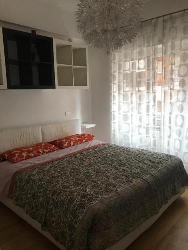 A bed or beds in a room at confortevole appartamento per 5 persone a Portuense