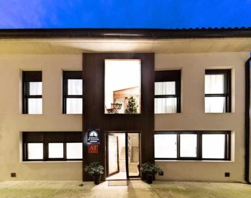 a building with a door in front of it at Apartamento rural Las Cañas Esencia de Bardenas in Villafranca