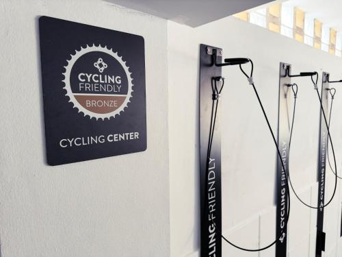 a sign for a cycling emergency shower hanging on a wall at BYPILLOW Villa Lorena Adults Recommended in Málaga