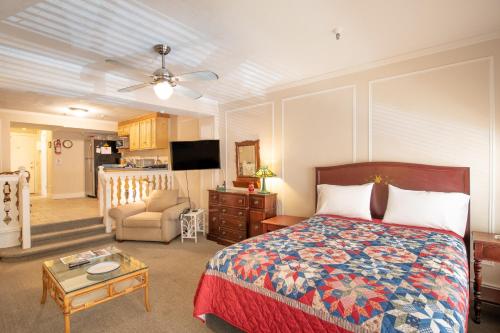 a bedroom with a bed and a living room at Historic Palm Beach Hotel #1106 in Palm Beach