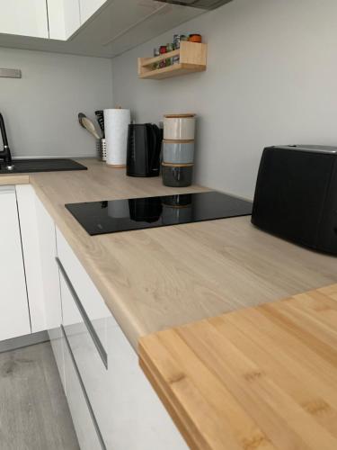 a kitchen with a counter top with a coffee maker on it at CP High floor luxury studio in Gibraltar