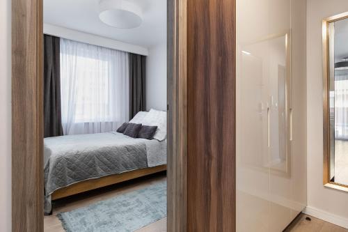 Postel nebo postele na pokoji v ubytování Apartament Holiday 9