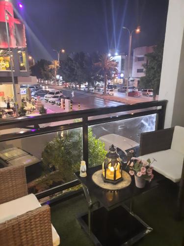 a room with a view of a city at night at فندق السليمانيه والرمال الزرقاء in Riyadh