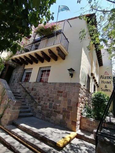 a building with stairs in front of it at Alamo Hostel & Suites in Mendoza