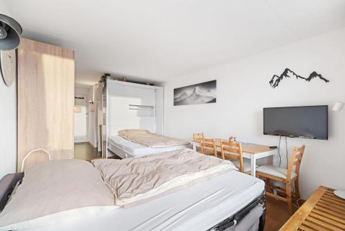 Postel nebo postele na pokoji v ubytování Chaleureux studio à Anzère, accessible à ski, proche de tout