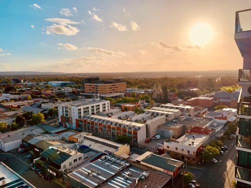 an aerial view of a city with buildings at CBD Stunning High Floor View - FREE Parking FREE Netflix FREE Gym FREE Pool FREE Sauna FREE Coffee in Adelaide