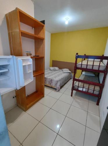 En eller flere senge i et værelse på MARAVISTA SUÍTES Ubatuba