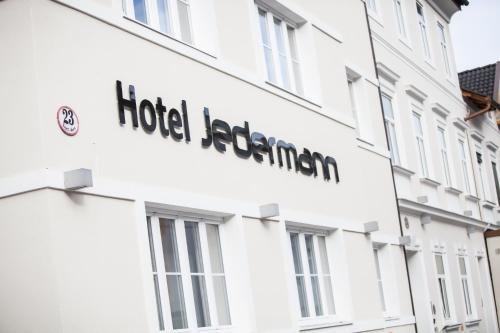 a sign for the hotel jerusalem on the side of a building at Das Jedermann Boutiquehotel mit Stadtgarten in Salzburg