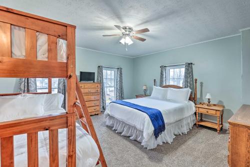 a bedroom with a bed and a ceiling fan at Victorian Home in Penn Yan about 1 Mi to Keuka Lake! in Penn Yan