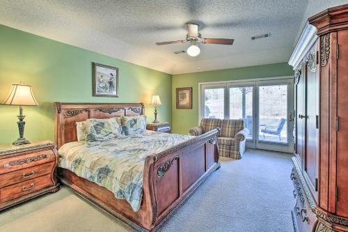 a bedroom with a bed and a ceiling fan at Lovely Hot Springs Home with Lake Balboa Access in Hot Springs Village