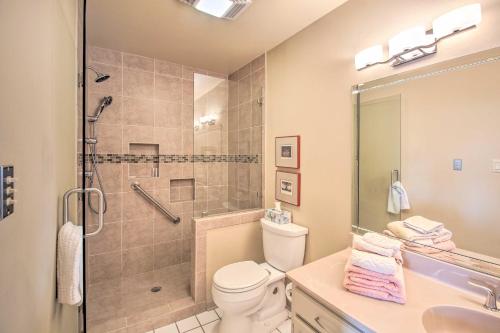 a bathroom with a shower and a toilet and a sink at Lakefront Hot Springs Condo with Boat Dock! in Hot Springs