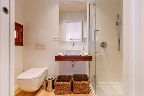 a bathroom with a sink and a toilet and a shower at Casa Rei Sanxo, 8A in Valldemossa
