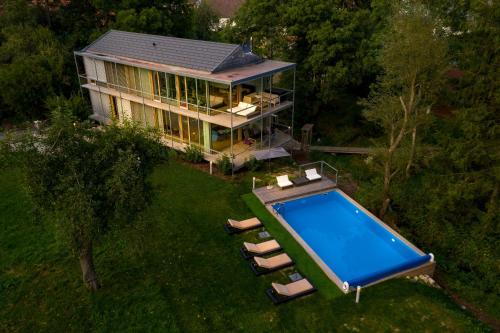 an aerial view of a house with a swimming pool at Donauoase in Donaueschingen