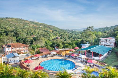 an aerial view of a resort with a swimming pool at Hotel Verde Menta in San Gil