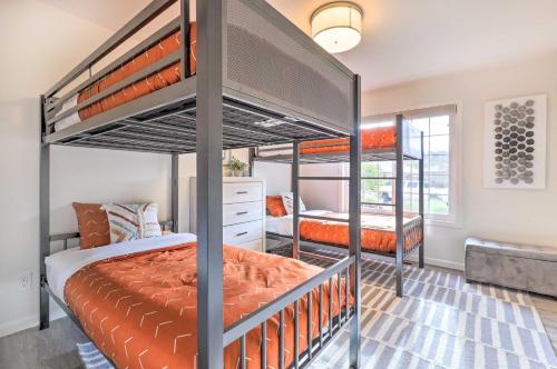 a bedroom with two bunk beds in a room at Peaceful Windsor Retreat with Private Hot Tub! in Windsor