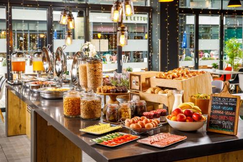 a counter with many different types of food on it at ibis Bristol Centre in Bristol