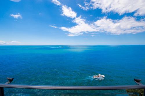 a boat in the middle of the ocean at La Perla di Nettuno in Furore