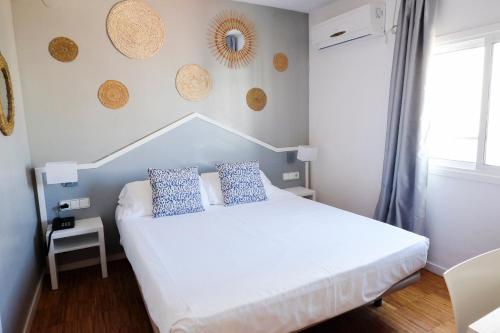 Postel nebo postele na pokoji v ubytování Hotel Subur