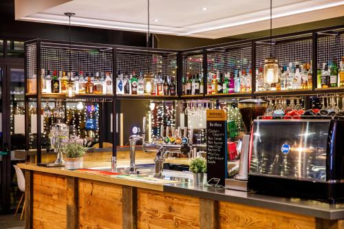 a bar with a counter with a microwave at ibis Bristol Centre in Bristol