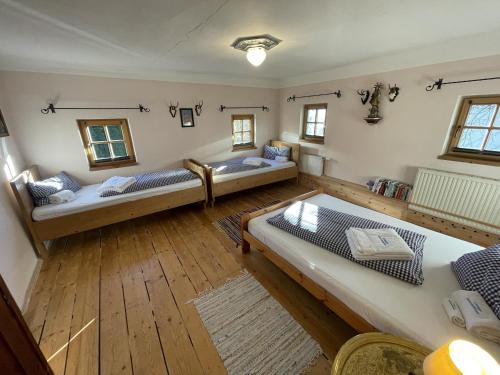 an aerial view of a living room with two beds at Geigerhaus 500 Jahre - Appt A in Stuhlfelden