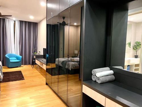 a room with a room with a bed and a mirror at KL Gateway Residency in Kuala Lumpur