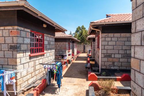 a group of buildings with red windows on them at RUN'IX ATHLETIC CENTER in Iten