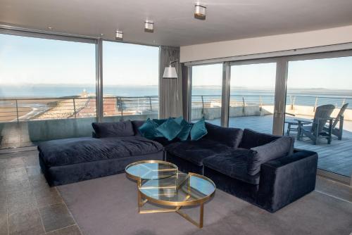 a living room with a couch and a table at The Midland in Morecambe