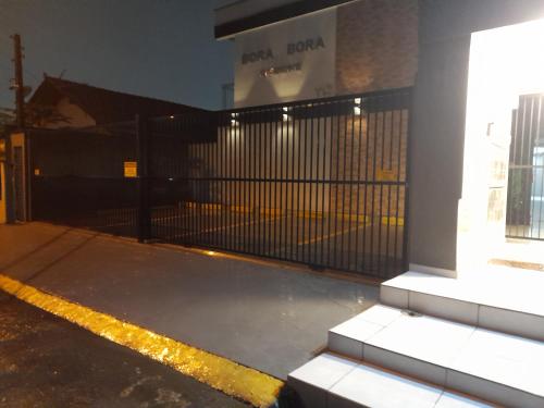 a black gate in front of a building at BORA BORA RESIDENCE in Joinville