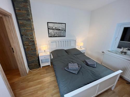 Postel nebo postele na pokoji v ubytování Gerolstein, Urlaub in der Eifel 2 - Ferienwohnung