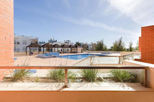 a view of a swimming pool from a balcony at Arco-Iris in Lagos