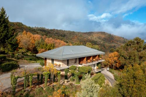 an aerial view of a house in the mountains at TheVagar Countryhouse in Belmonte
