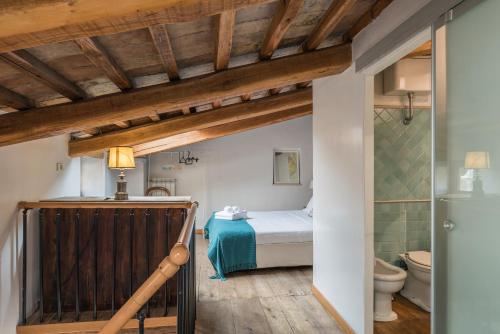 Vuode tai vuoteita majoituspaikassa Cozy Wooden APT in Piazza NAVONA