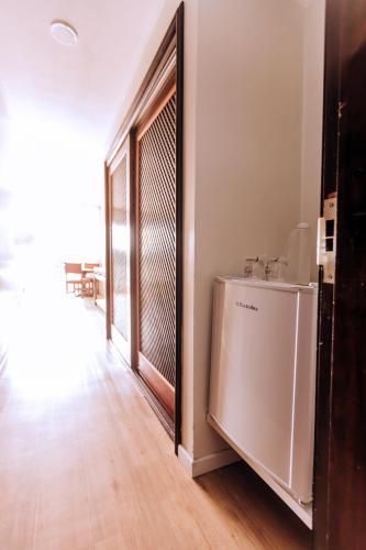 a hallway with a door leading into a room at Plaza Caldas da Imperatriz Resort & Spa in Santo Amaro da Imperatriz
