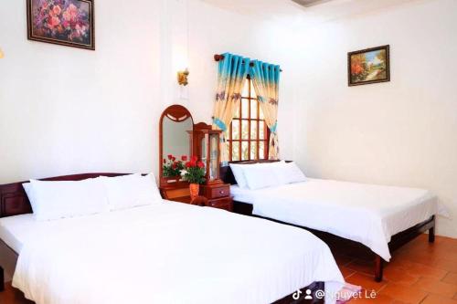 Voodi või voodid majutusasutuse Bungalow Hà Thu toas