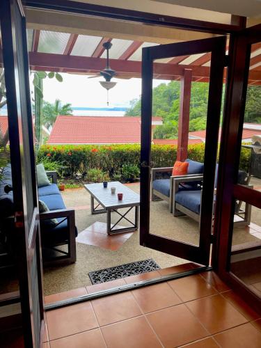 a view of a living room with a table and chairs at Bahia Pez Vela Resort in Ocotal