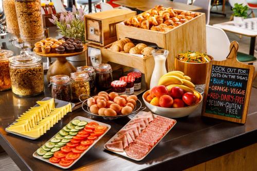 a table with many different types of food on it at ibis Bristol Centre in Bristol