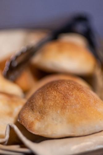 a group of bread rolls sitting on a plate at Casa Villa Arequipa in Arequipa