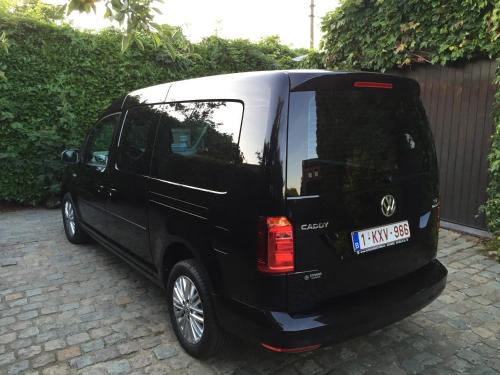 a black van parked on a brick driveway at B&B Carisma in Lochristi