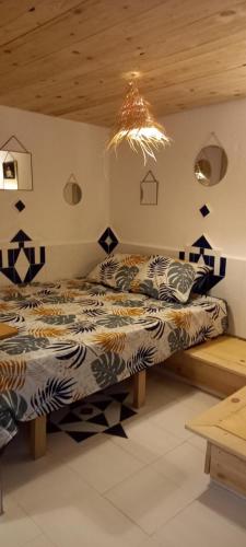 a bedroom with two beds in a room at Dar jilali in Taghazout