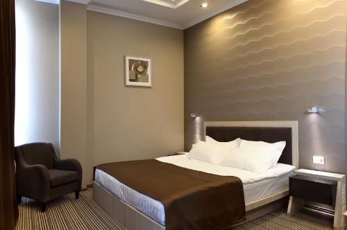 Postel nebo postele na pokoji v ubytování Vicomte Hotel