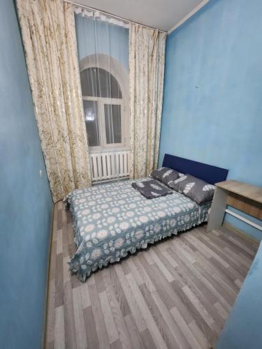Ένα ή περισσότερα κρεβάτια σε δωμάτιο στο Оазис