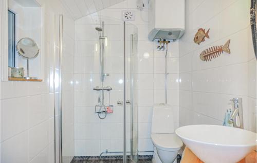 a bathroom with a shower and a toilet and a sink at Stunning Home In Arvika With 1 Bedrooms in Arvika